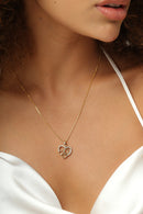 Colar coração cravejado com corações vazados dentro