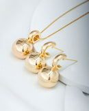 Conjunto argolinha com meia esfera